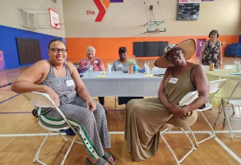 seniors at a table smiling
