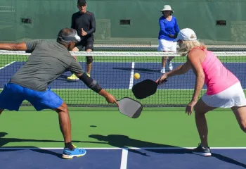 man and woman doubles pickleball