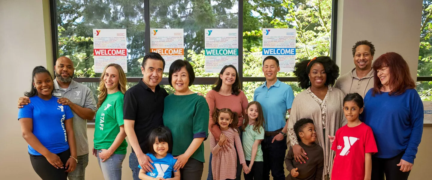 group of people standing in a ymca