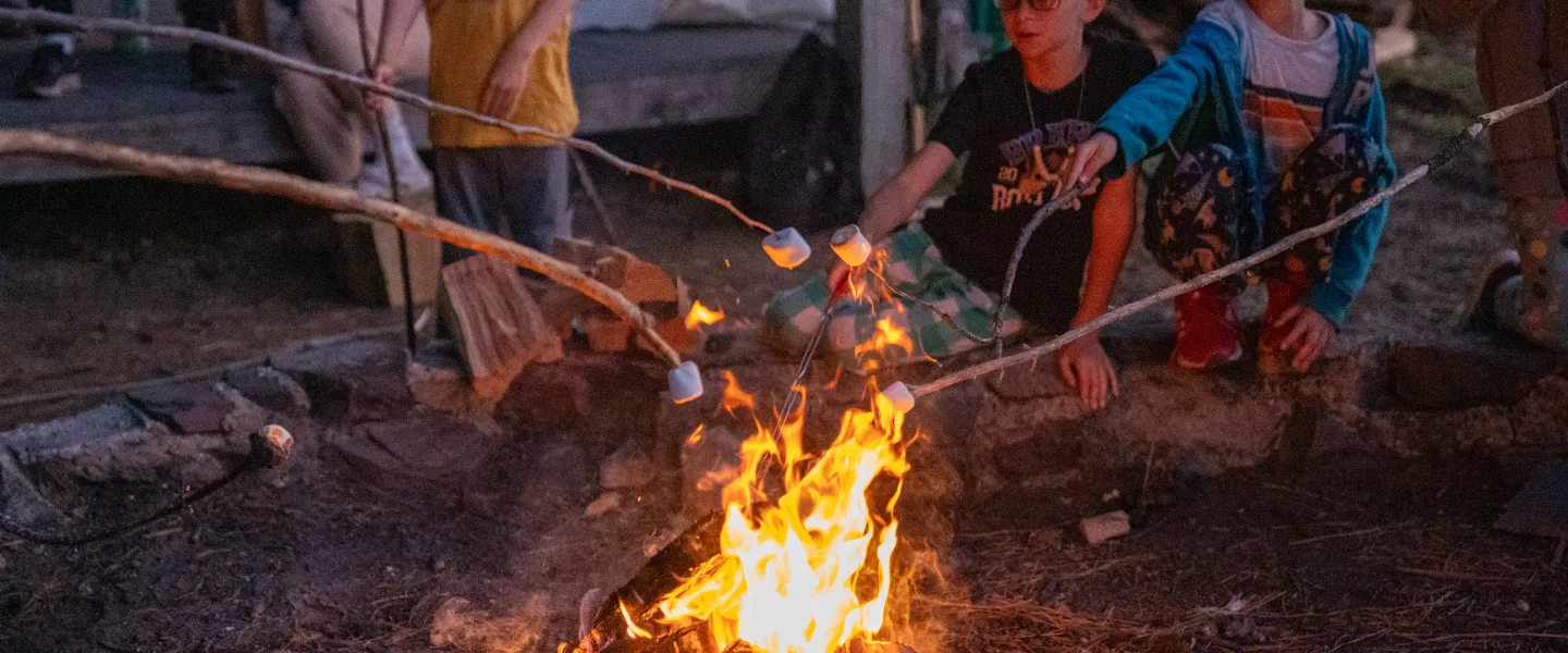 camp fire kids roasting marshmallows