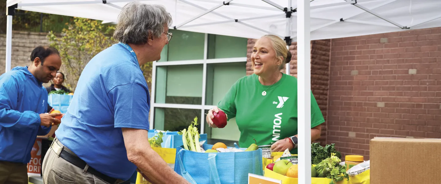 Women handing out food for the community.