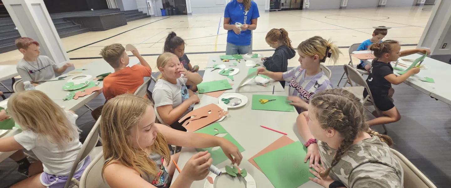group of kids doing an art activity summer at the Y