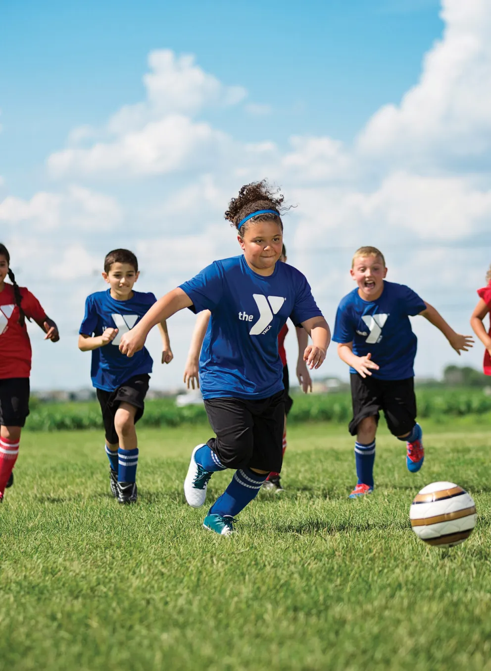 girl kicking soccer ball