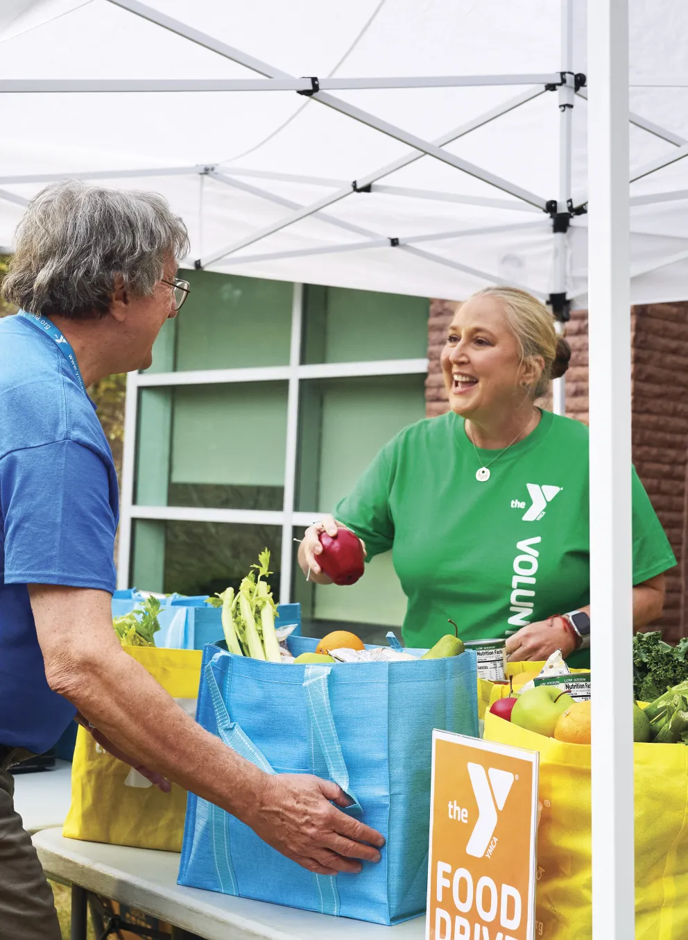 Women handing out food for the community.