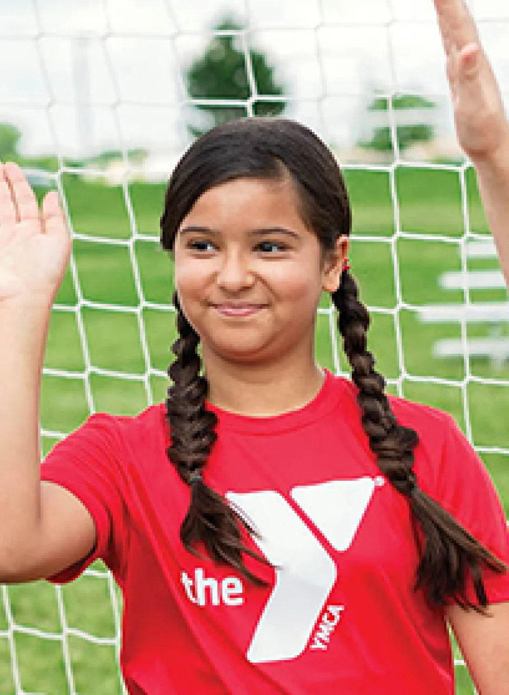 soccer goalie high fiving other kids
