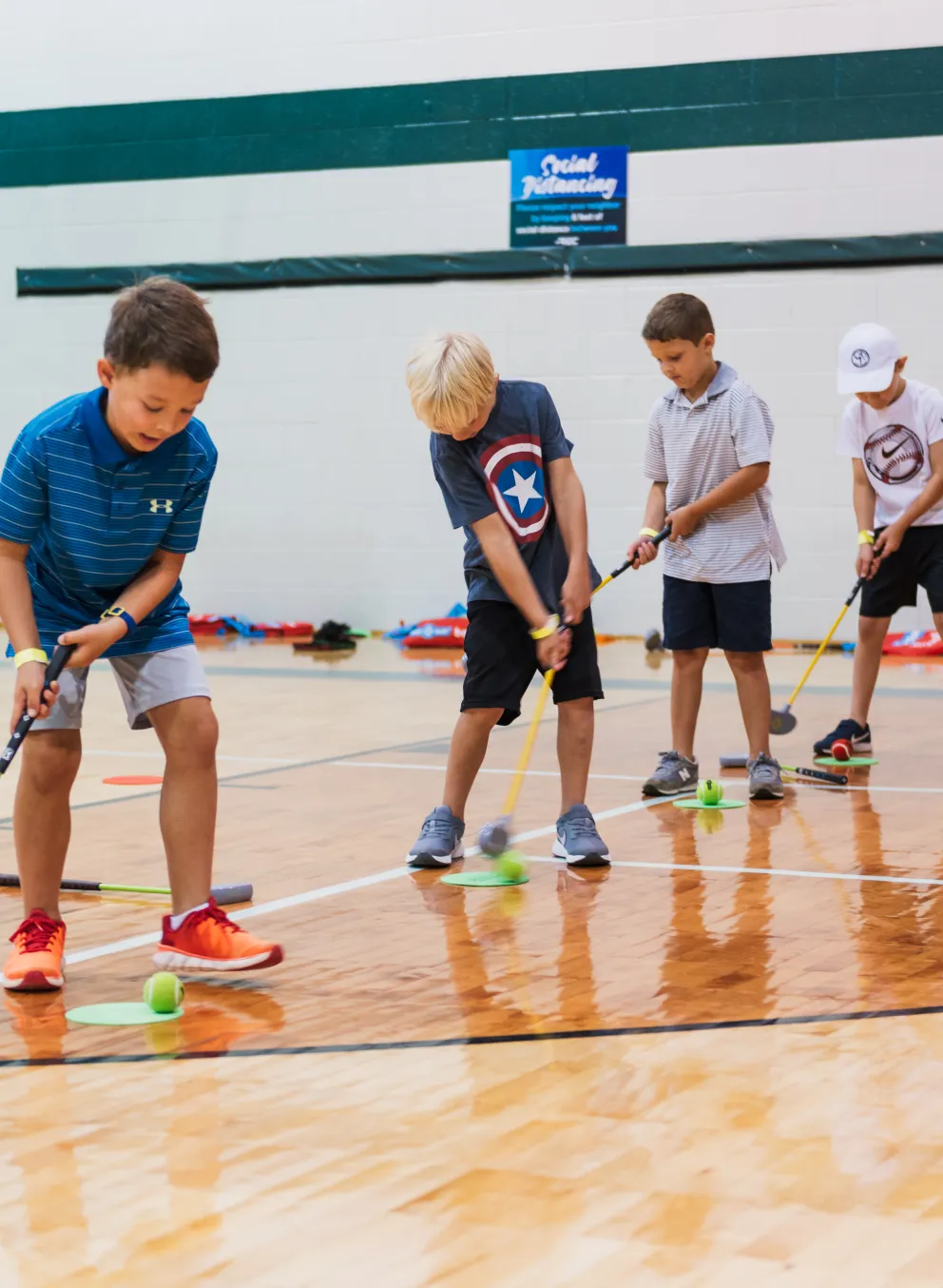 kids playing indoor golf