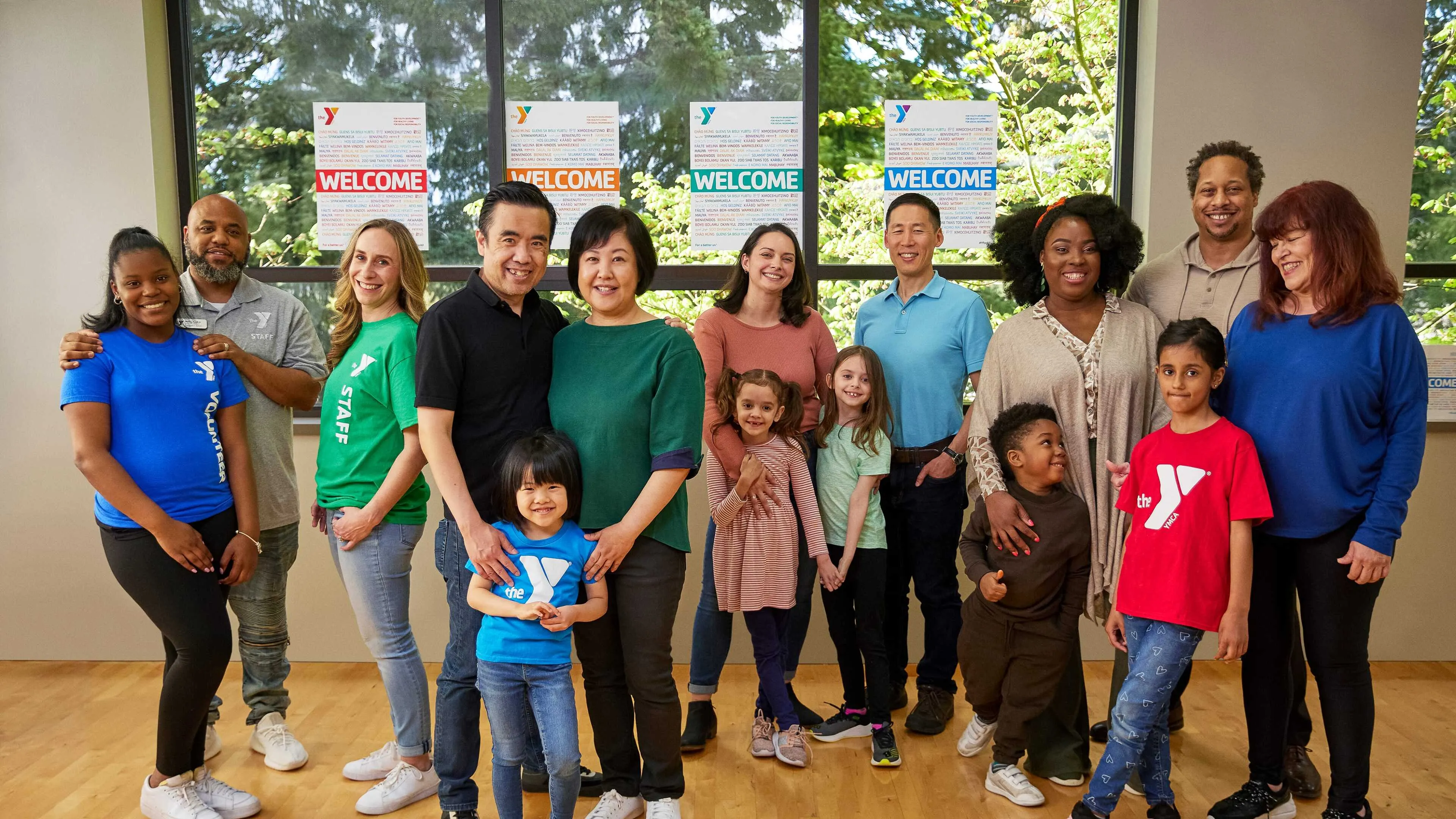group of people standing in a ymca