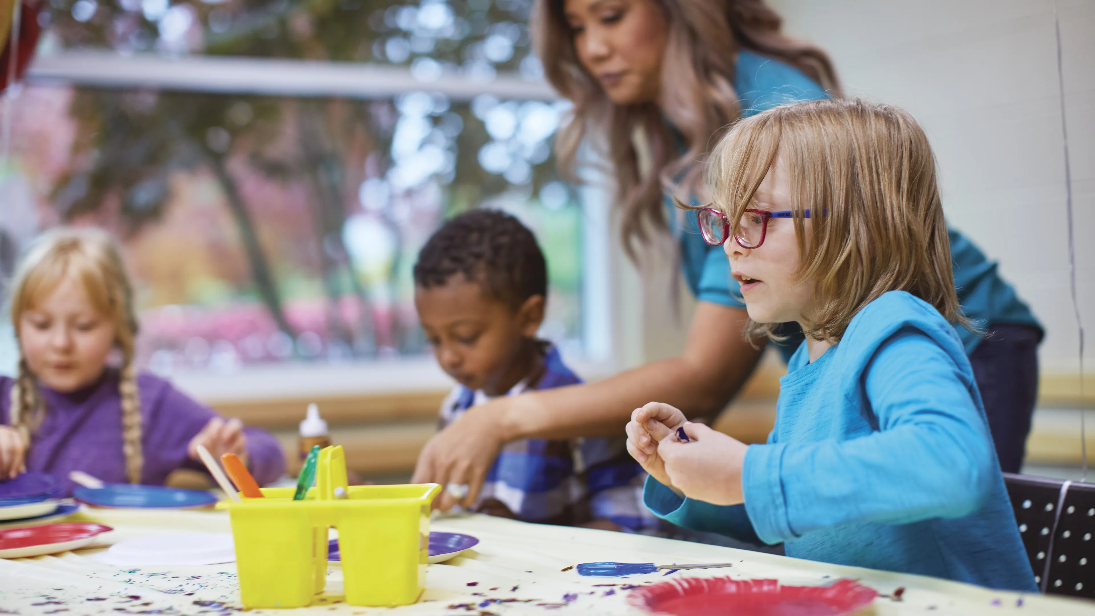 child doing art