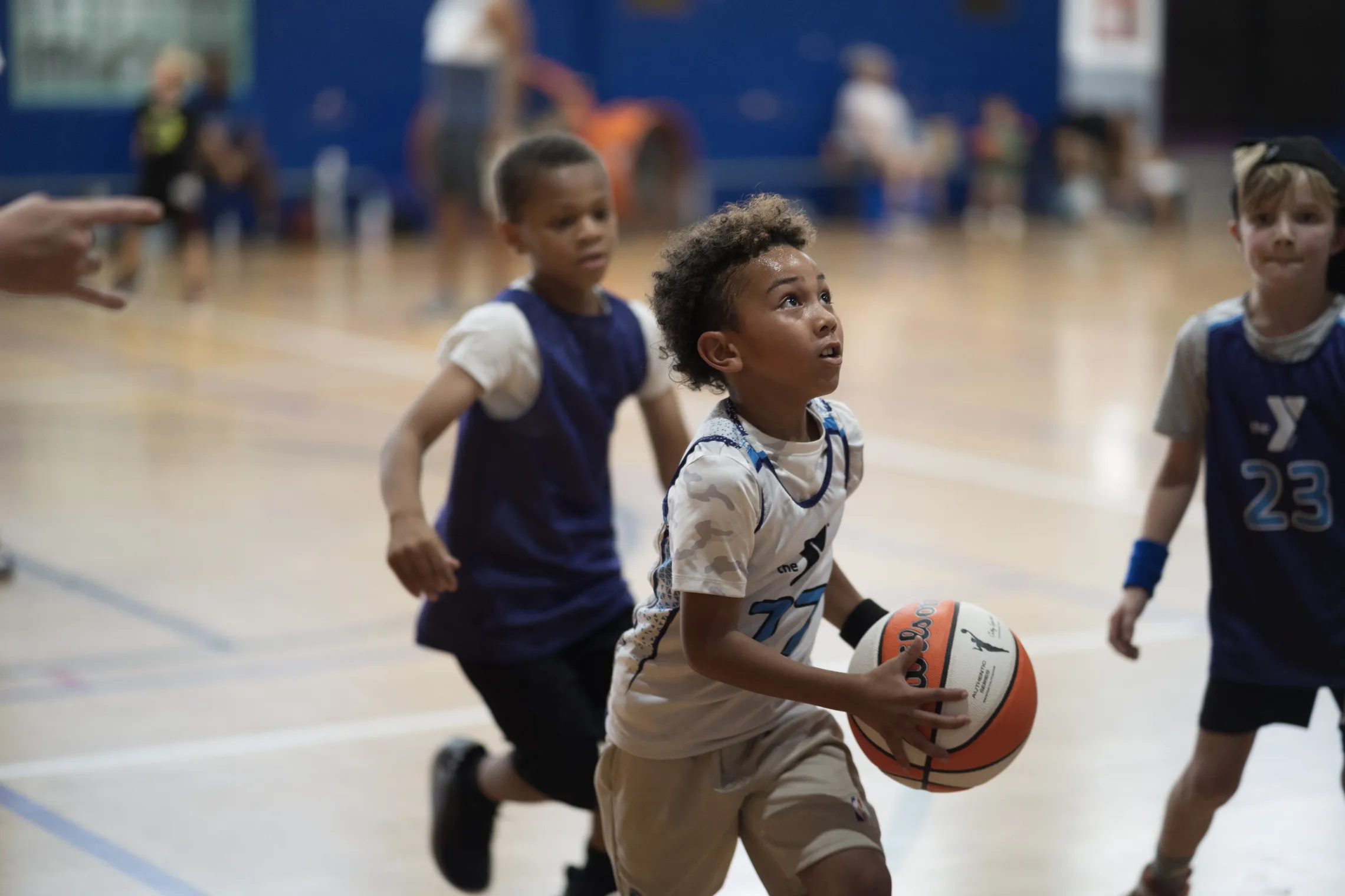 kid playing basketball about to shoot
