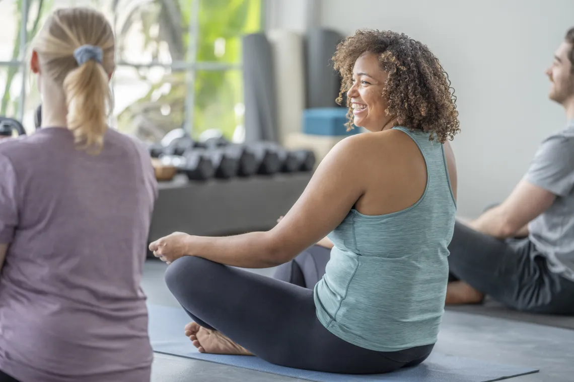 individual woman in a yoga class