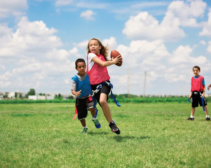 girl playing flag football