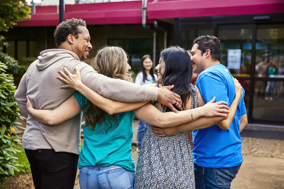 four people walking together