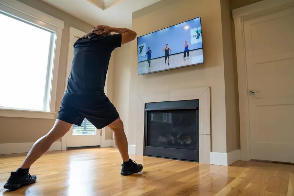 man taking virtual fitness class
