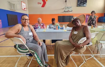 seniors at a table smiling