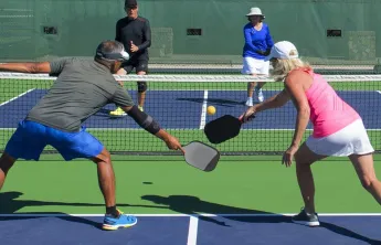 man and woman doubles pickleball