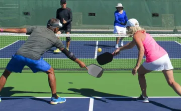 man and woman doubles pickleball