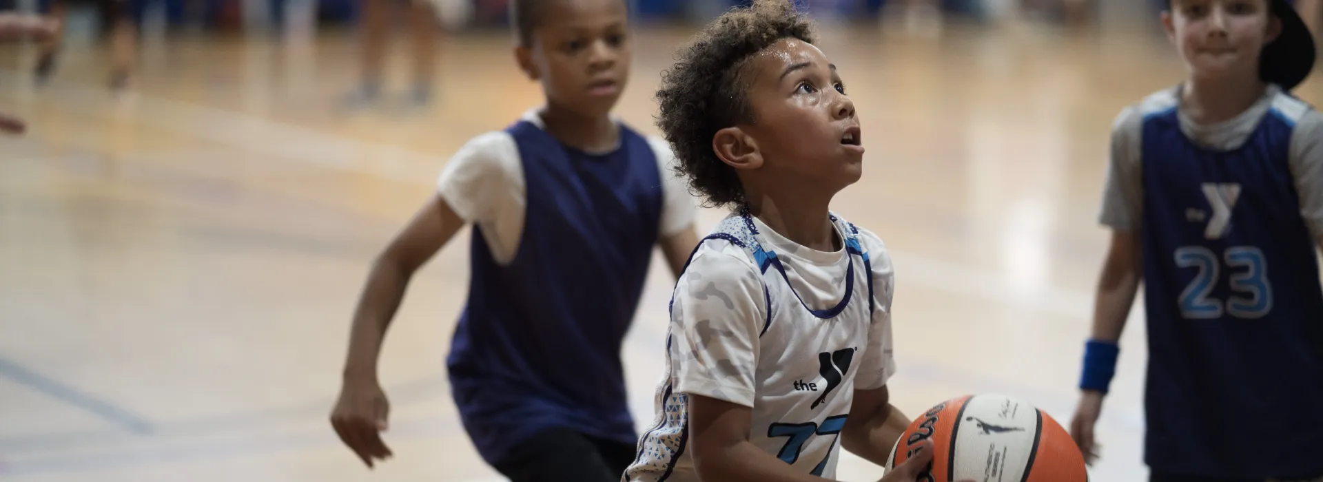 little boys playing basketball