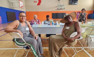 seniors at a table smiling